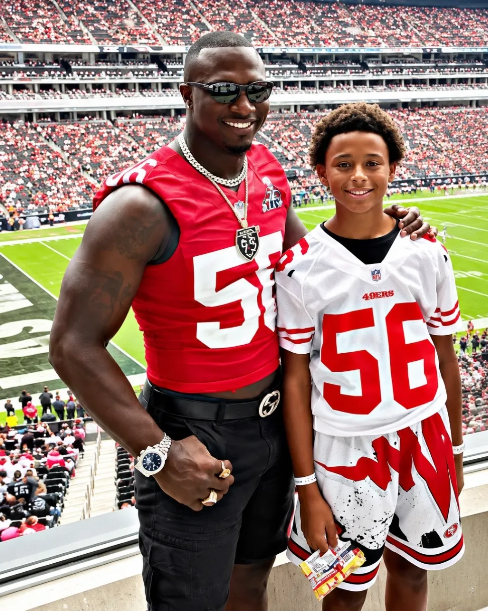 Tavares Gooden standing with his son in San Francisco 49ers jerseys in the stadium stands